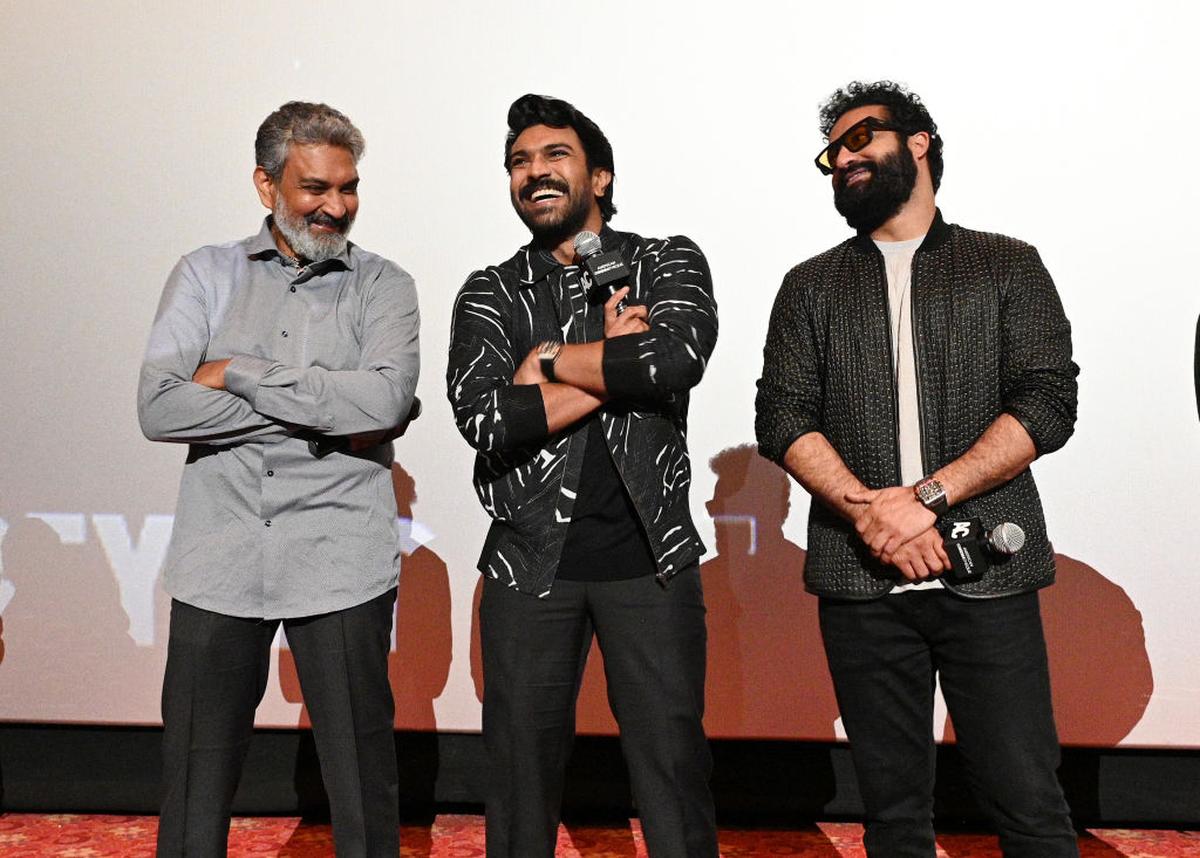 (L to R) Director S.S. Rajamouli and actors Ram Charan and N.T. Rama Rao Jr. at a promotional event for their film RRR in Los Angeles, January 2023. (L to R) Director S.S. Rajamouli and actors Ram Charan and N.T. Rama Rao Jr. at a promotional event for their film RRR in Los Angeles, January 2023.