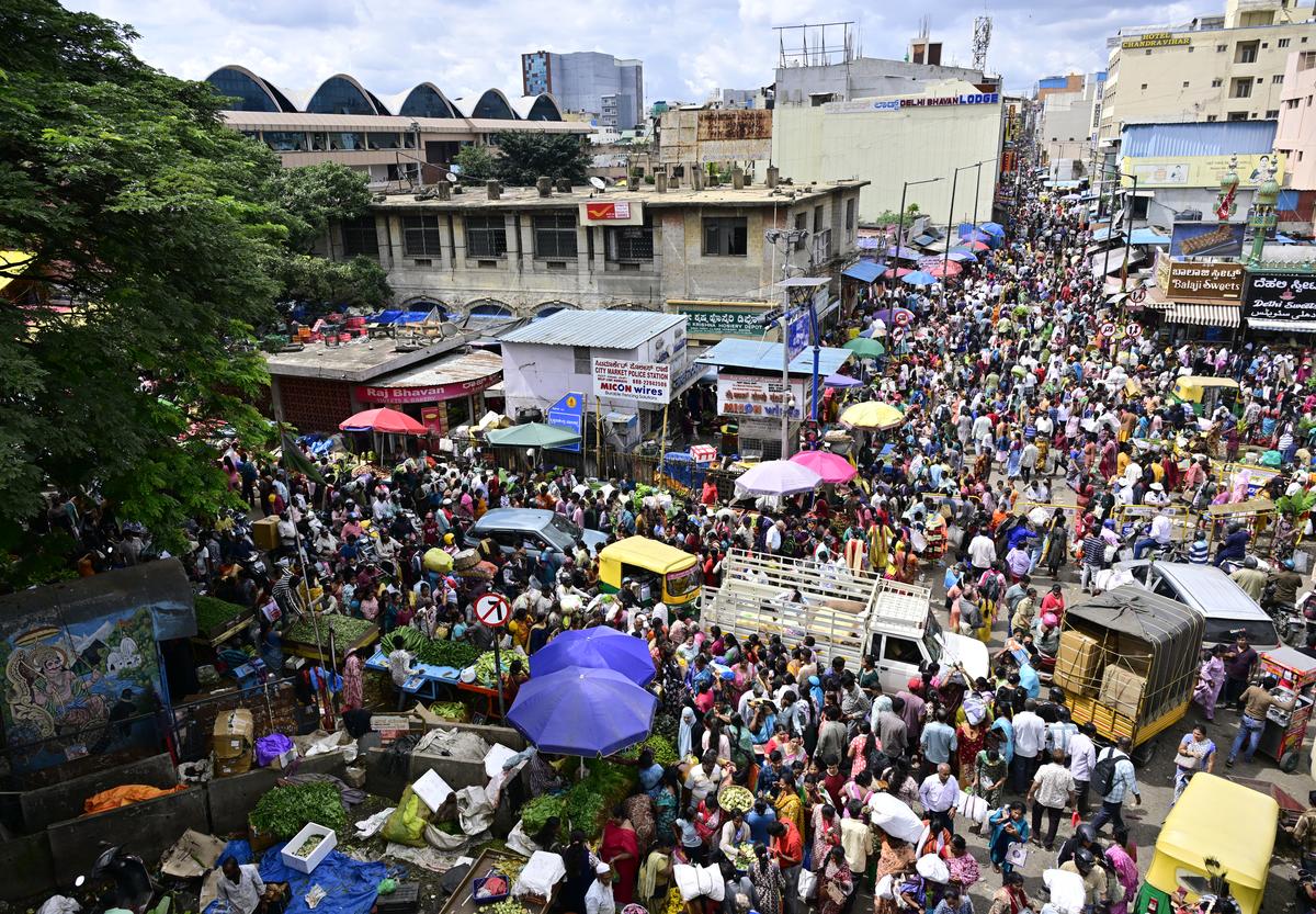 People shopping at K.R. Market in Bengaluru on Wednesday.