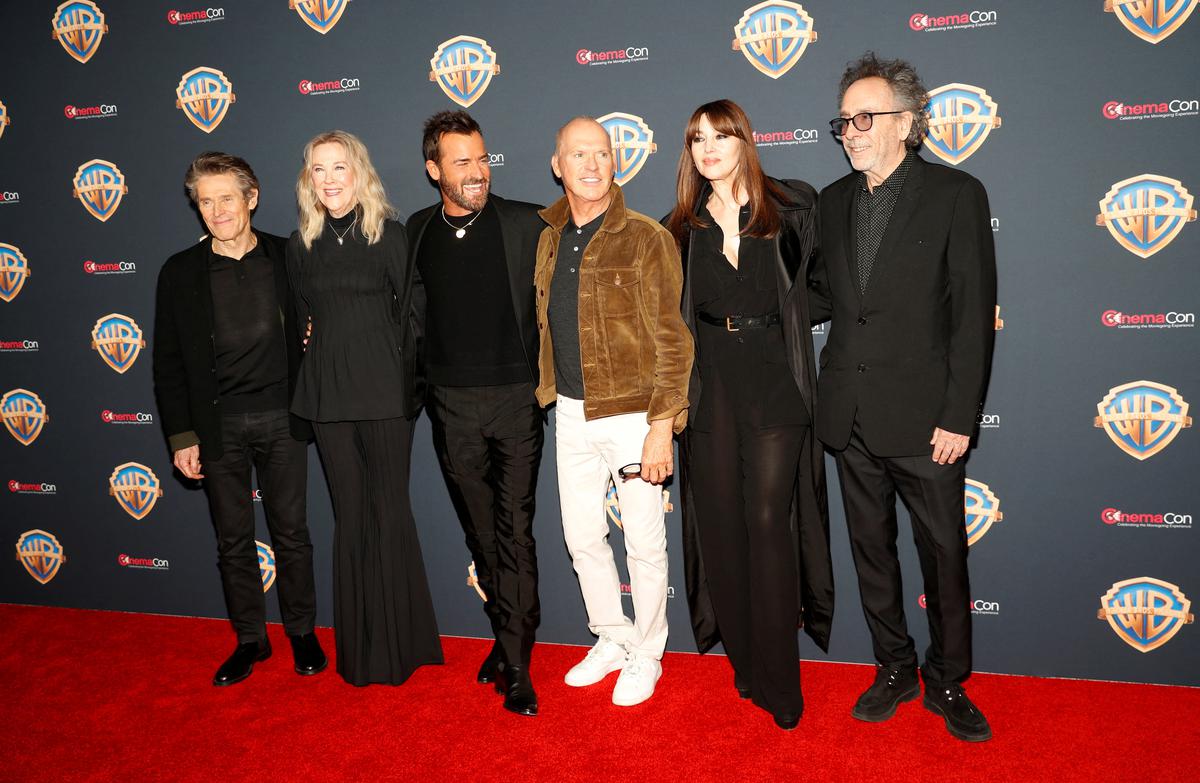 ‘Beetlejuice Beetlejuice’ cast members Willem Dafoe, Catherine O’Hara, Justin Theroux, Michael Keaton, Monica Bellucci, and director and producer Tim Burton pose on the red carpet during a Warner Bros. presentation at CinemaCon