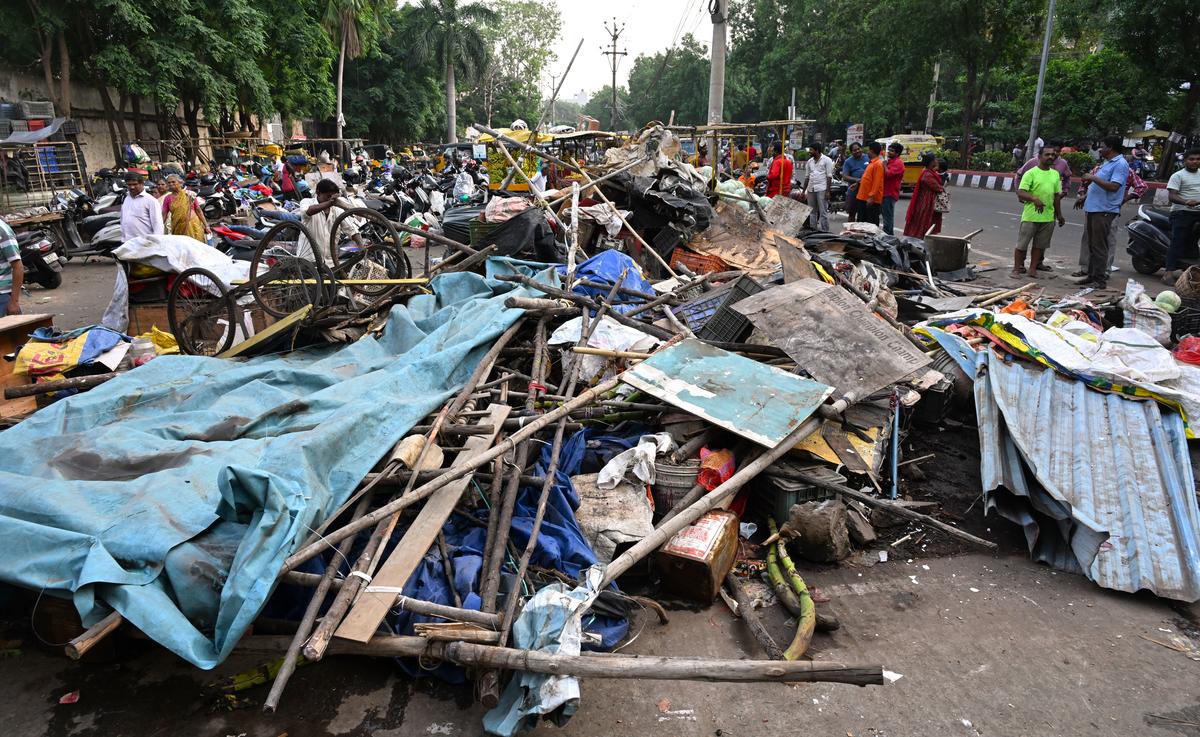 Vendors salvaging their belongings after the GVMC dismantled carts and small scale shops as part of ‘Operation Lungs 2.0’ at Seethammadhara in Visakhapatnam.
