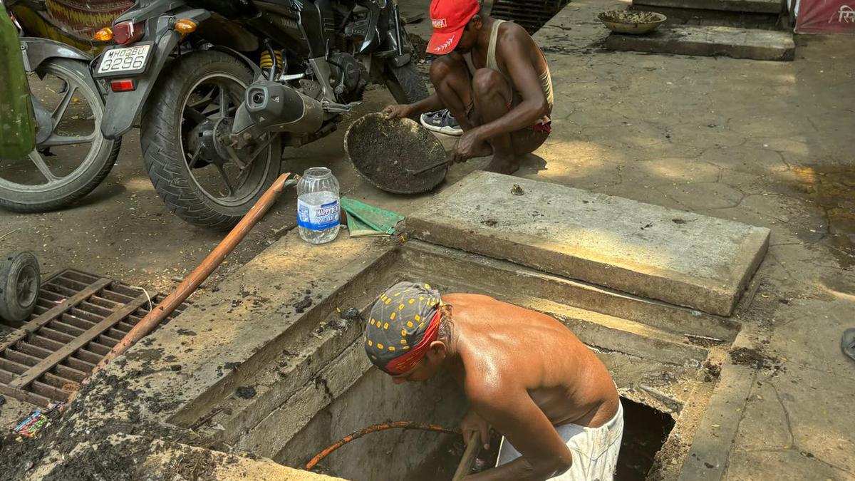 The invisible lives of sanitation workers who clean Mumbai’s drains to keep it from drowning