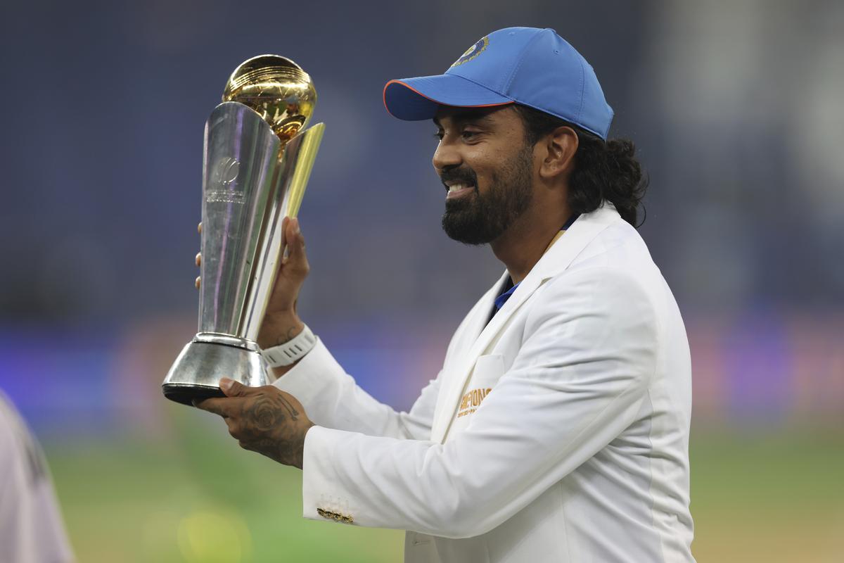 Rahul poses with the ICC Champions Trophy.