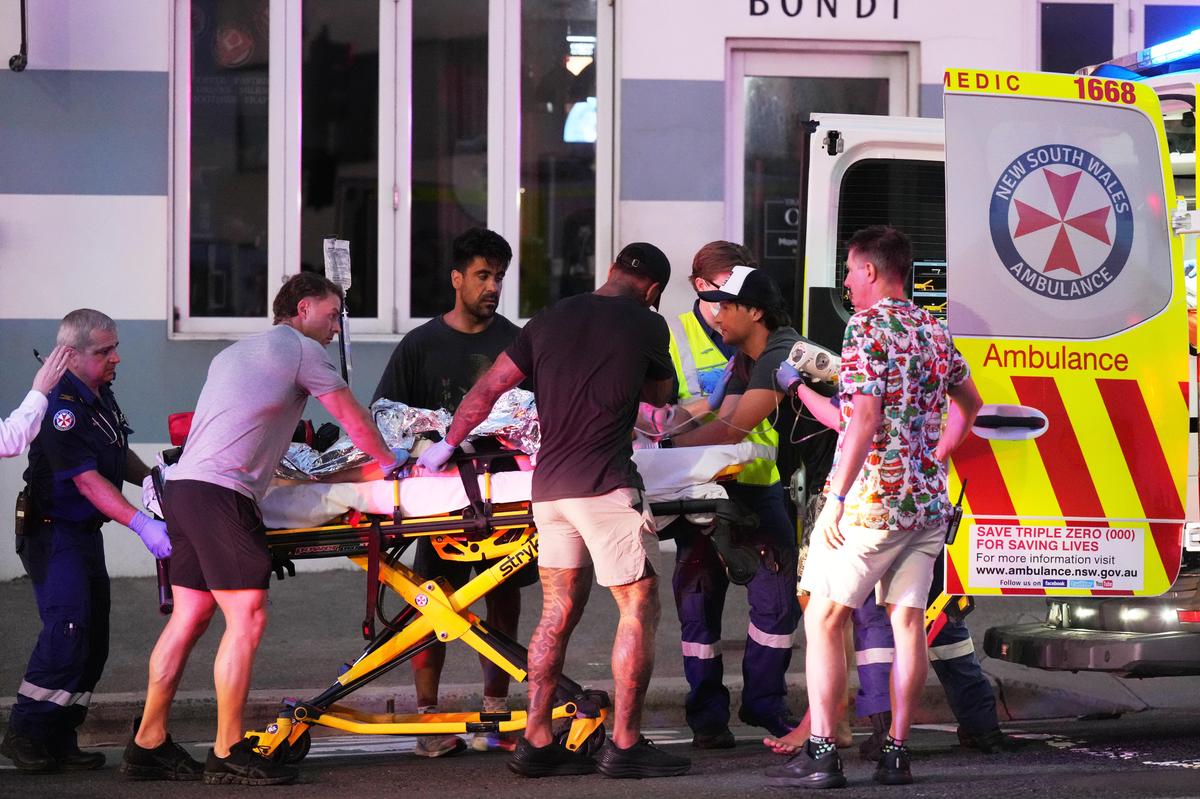 Emergency workers transport a person on a stretcher after a reported shooting at Bondi Beach in Sydney on December 14, 2025. Emergency workers transport a person on a stretcher after a reported shooting at Bondi Beach in Sydney on December 14, 2025.