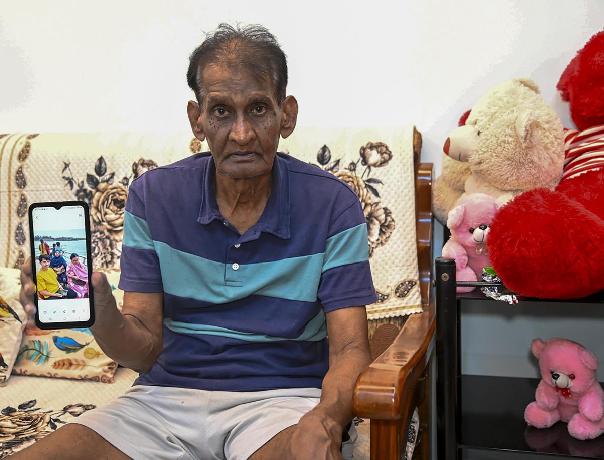 Riyaz Hussain Sayyed, 72, a survivor of the Jabalpur cruise tragedy, shows a photo he took of his family members on the deck of the vessel just a few minutes before the tragedy.