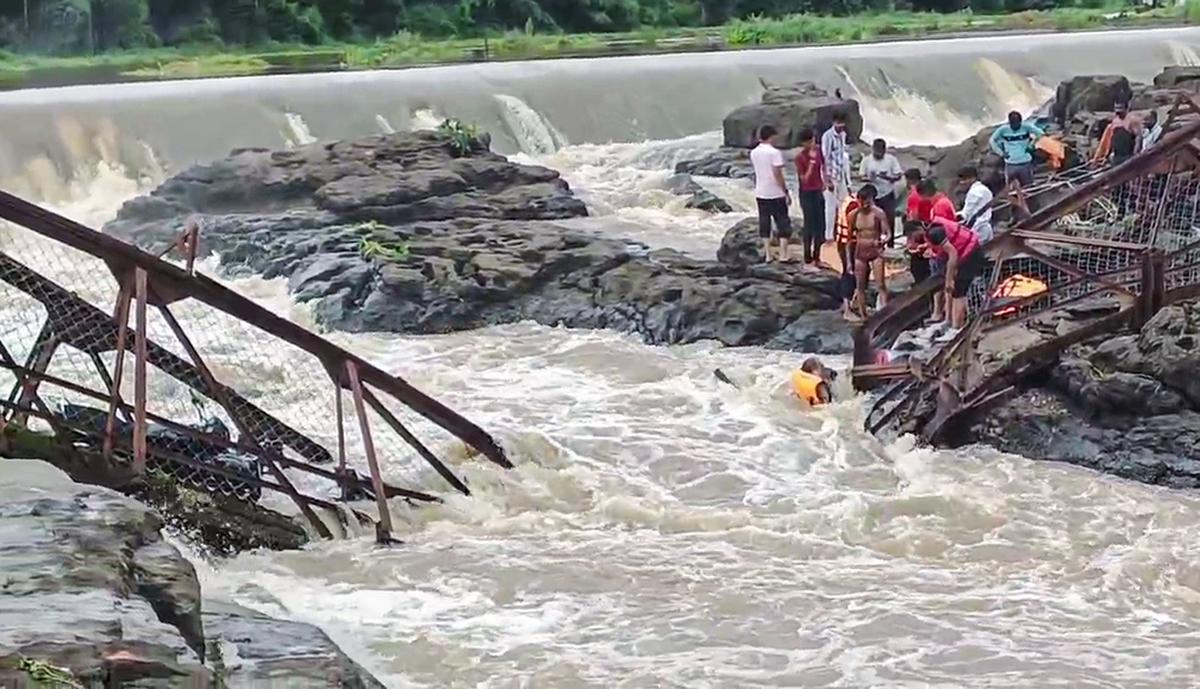 Pune, Jun 15 (ANI): People Seen at the site after a bridge collapsed on the indrayani river Near Kundamala Village, under the pimpri-chinchwad police station, in pune on Sunday. Reportedly, four to six people rescued and 10 to 15 people feared trapped. (Pimpri chinchwad police/ani photo) Pune, Jun 15 (ANI): People Seen at the site after a bridge collapsed on the indrayani river Near Kundamala Village, under the pimpri-chinchwad police station, in pune on Sunday. Reportedly, four to six people rescued and 10 to 15 people feared trapped. (Pimpri chinchwad police/ani photo)