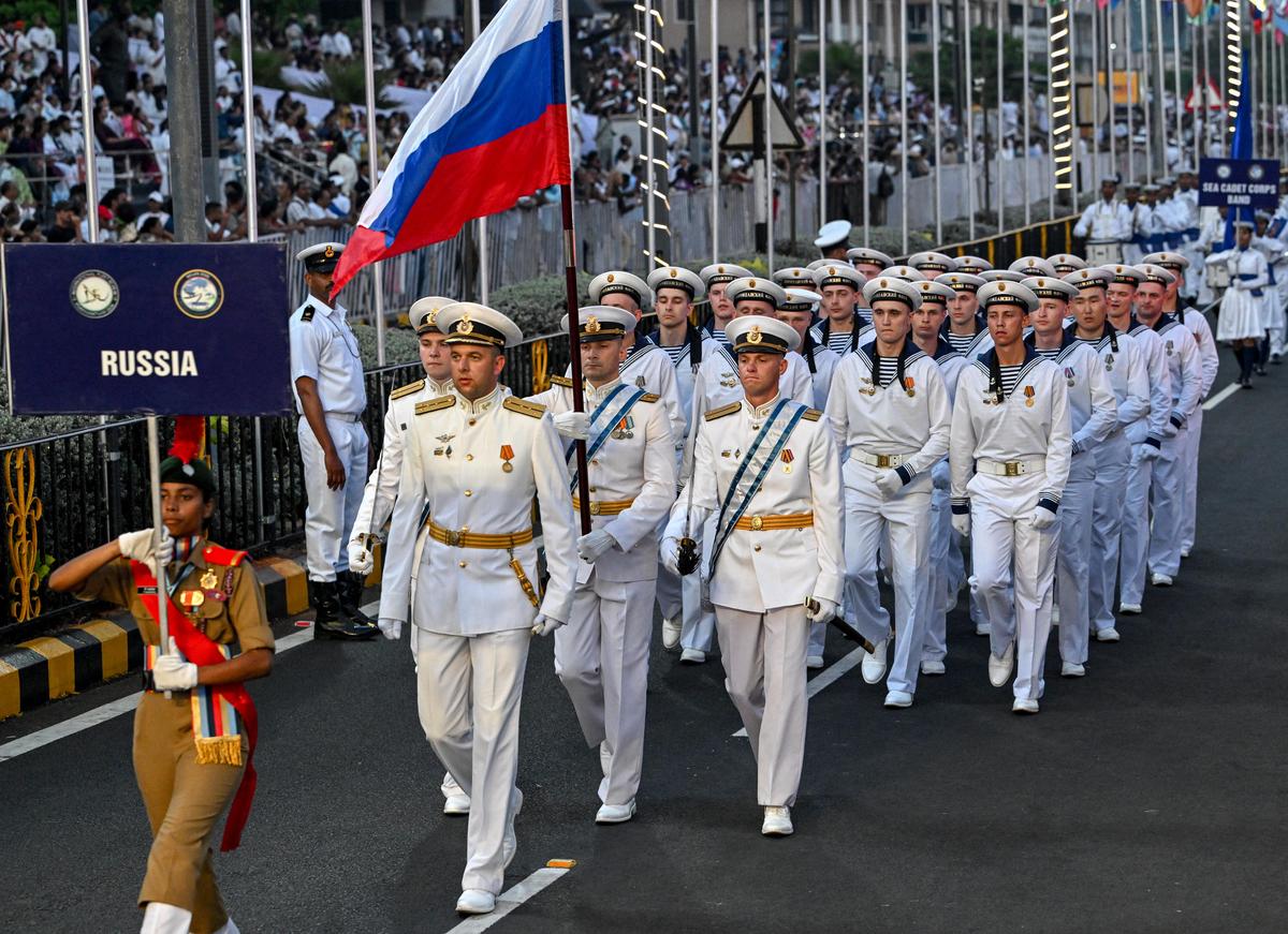 Russian Naval personnel march in a perfect formation. 