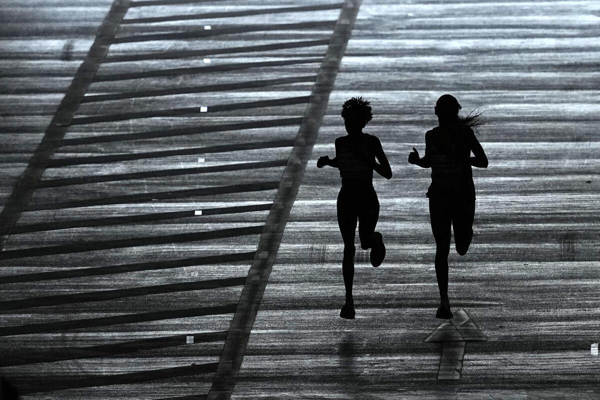 Shaking off a shadow: Jepchirchir and Tigst Assefa were locked in an epic tussle in Tokyo, which the Kenyan ended with a lung-busting sprint. Shaking off a shadow: Jepchirchir and Tigst Assefa were locked in an epic tussle in Tokyo, which the Kenyan ended with a lung-busting sprint.