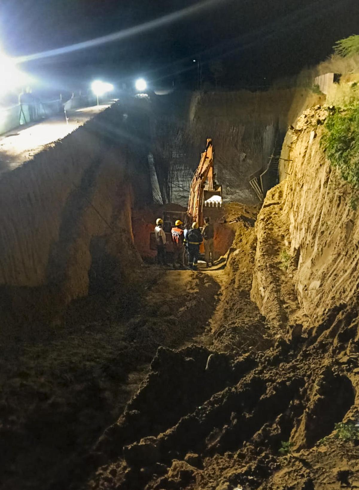 Rescue personnel carry out an operation after an under-construction wall collapsed on Monday, in Gurugram, late on March 9, 2026.