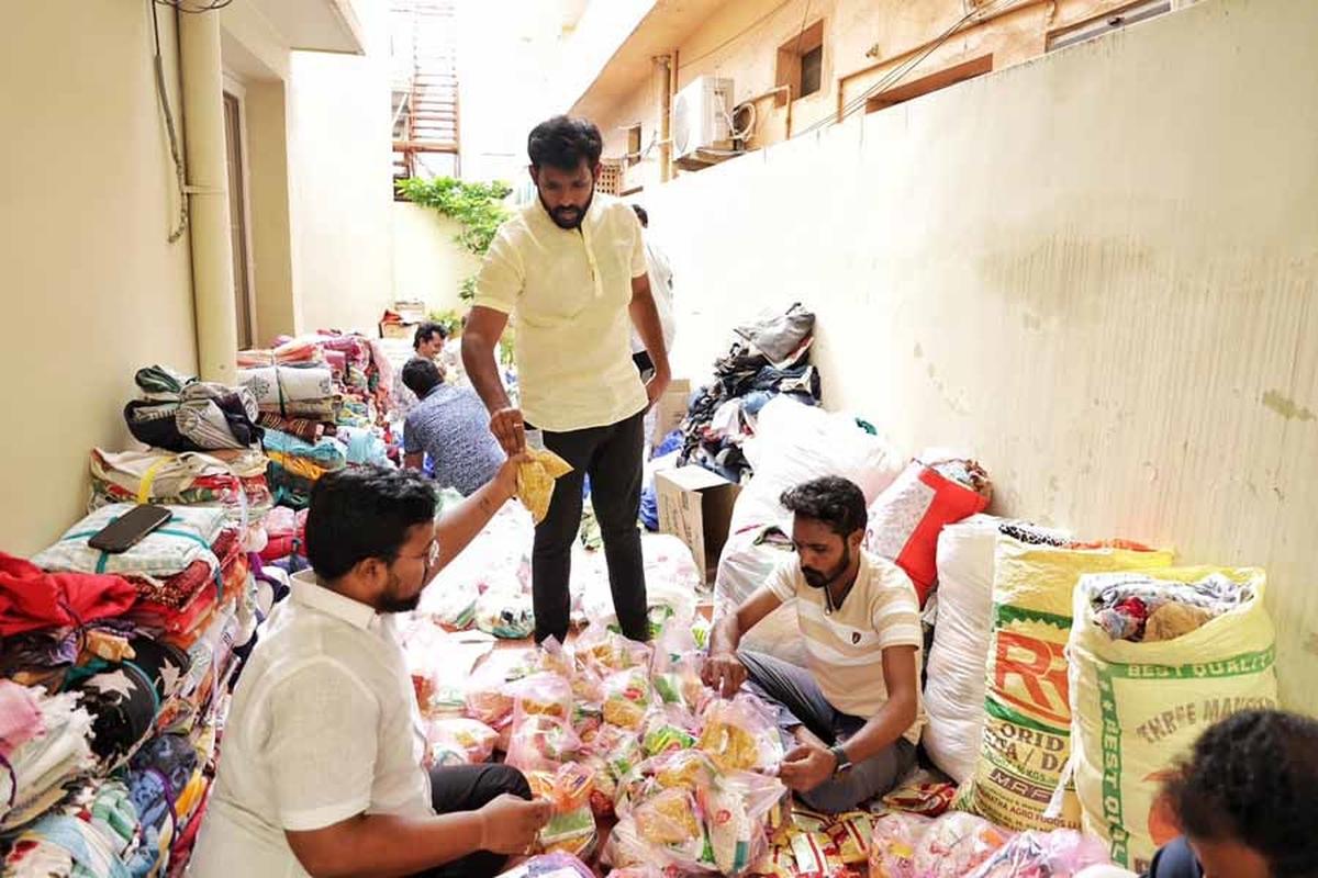 VNU founder Naga Sravan Kilaru packing relief material for the flood-hit, along with his team members, in Vijayawada.  