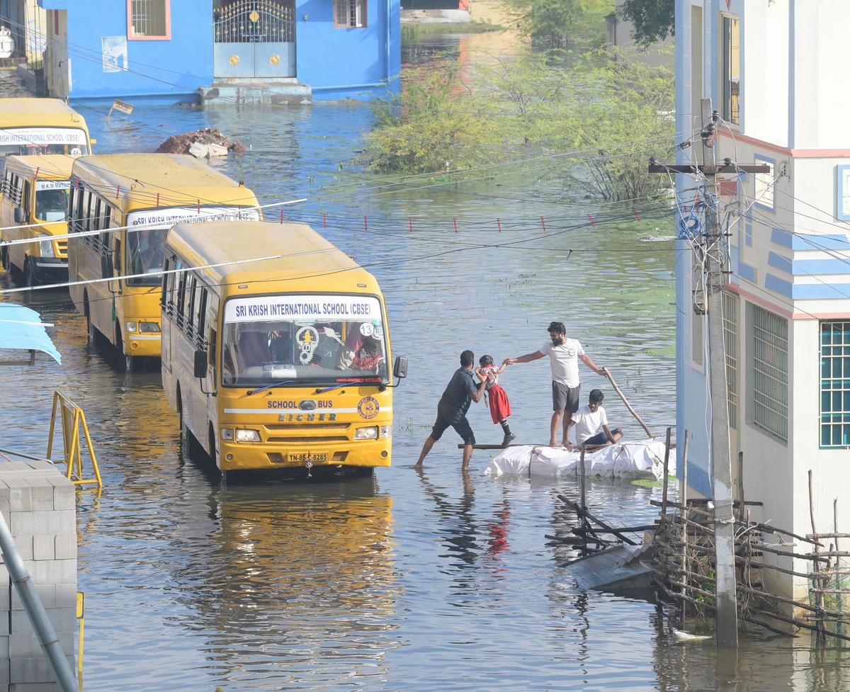 Boats ferry children to school on flooded roads in Iyyappanthangal and Moulivakkam