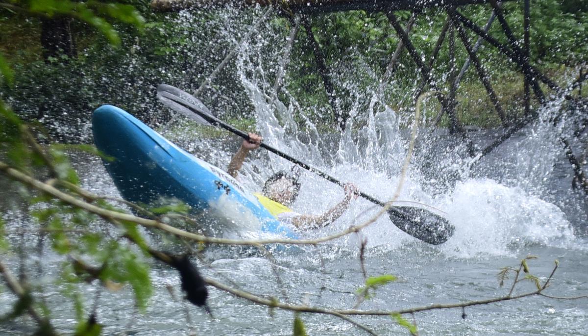 One of the young contestants tries to emerge from the rapids after he lost control over the kayak during the international white-water kayaking championship at Pulikkayam, near Kodenchery, in Kozhikode district on Friday.