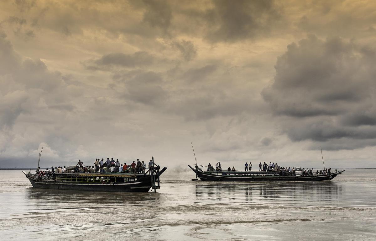 Two public boats carrying passengers, motor cycles etc ply across the Brahmaputra river between Majuli and Jorhat in Assam.