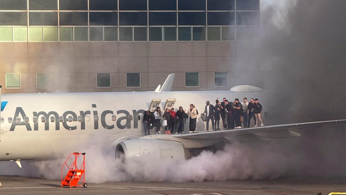 12 taken to hospitals after American Airlines plane catches fire at Denver airport gate