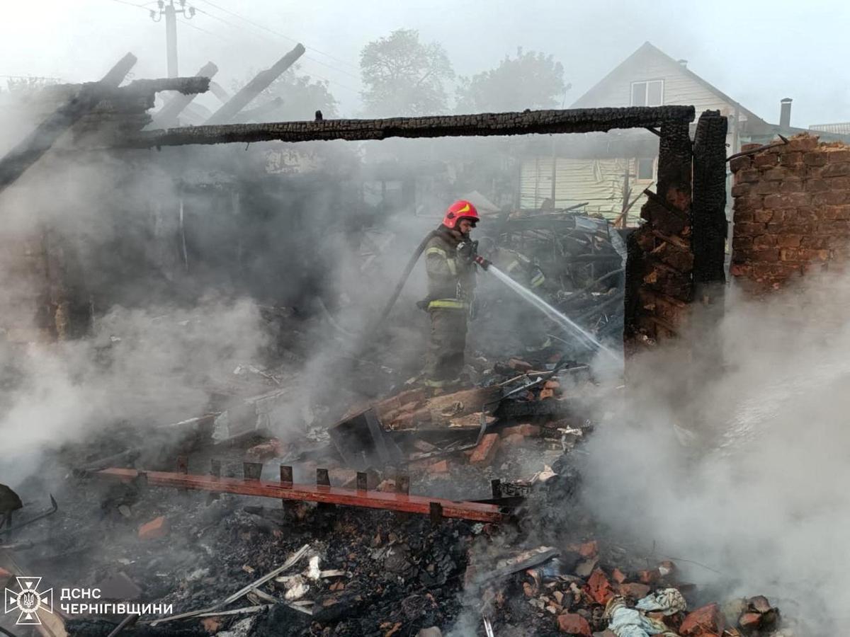 A firefighter works at a site of buildings hit by a Russian drone strike, amid Russia’s attack on Ukraine, in the town of Pryluky, Chernihiv region, Ukraine, in this handout picture released June 5, 2025.  
