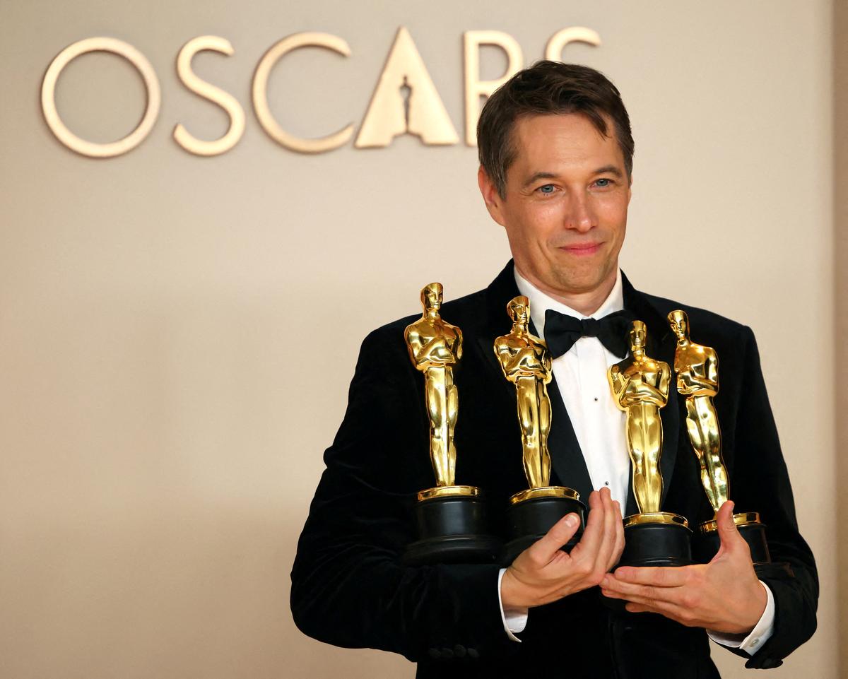 Director Sean Baker holds the Oscars for Best Picture, Best Director, Best Film Editing and Best Original Screenplay for “Anora” , in the Oscars photo room at the 97th Academy Awards in Hollywood, Los Angeles, California, U.S., March 2, 2025.