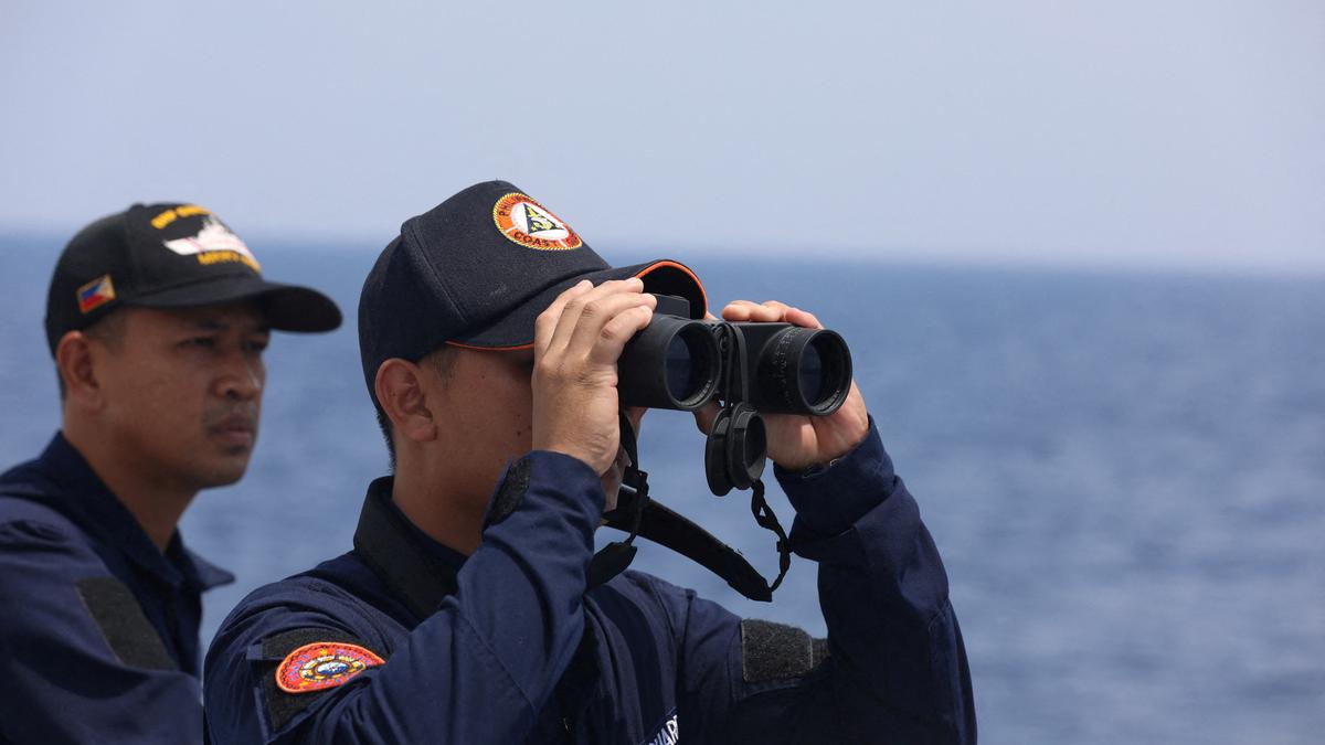 Philippines sends ships to disputed atoll where China building 'artificial island'