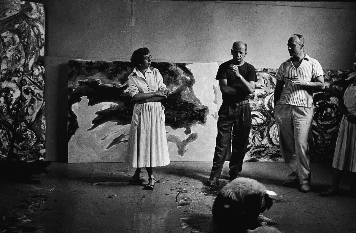 American abstract expressionist painter couple Lee Krasner (far left) and Jackson Pollock (in black), in the latter’s studio in New York, August 1953.