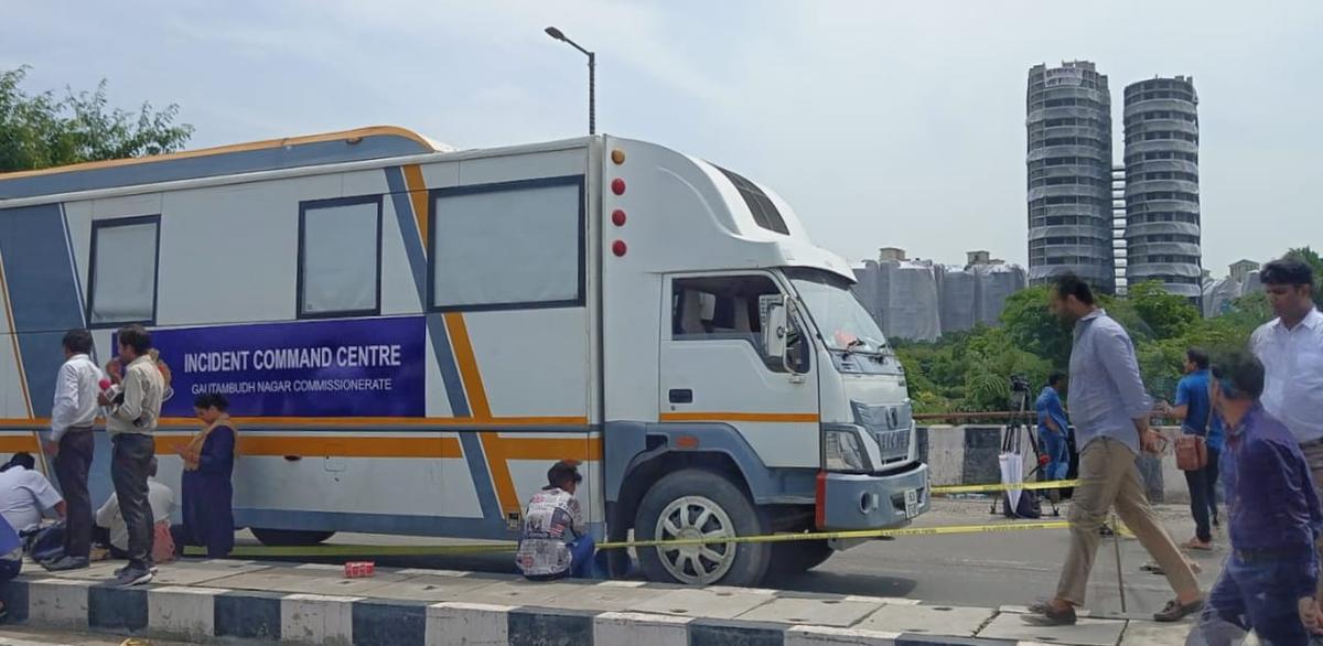 Incident Command Center van to monitor the demolition of the Twin Towers seen in the background in Noida.