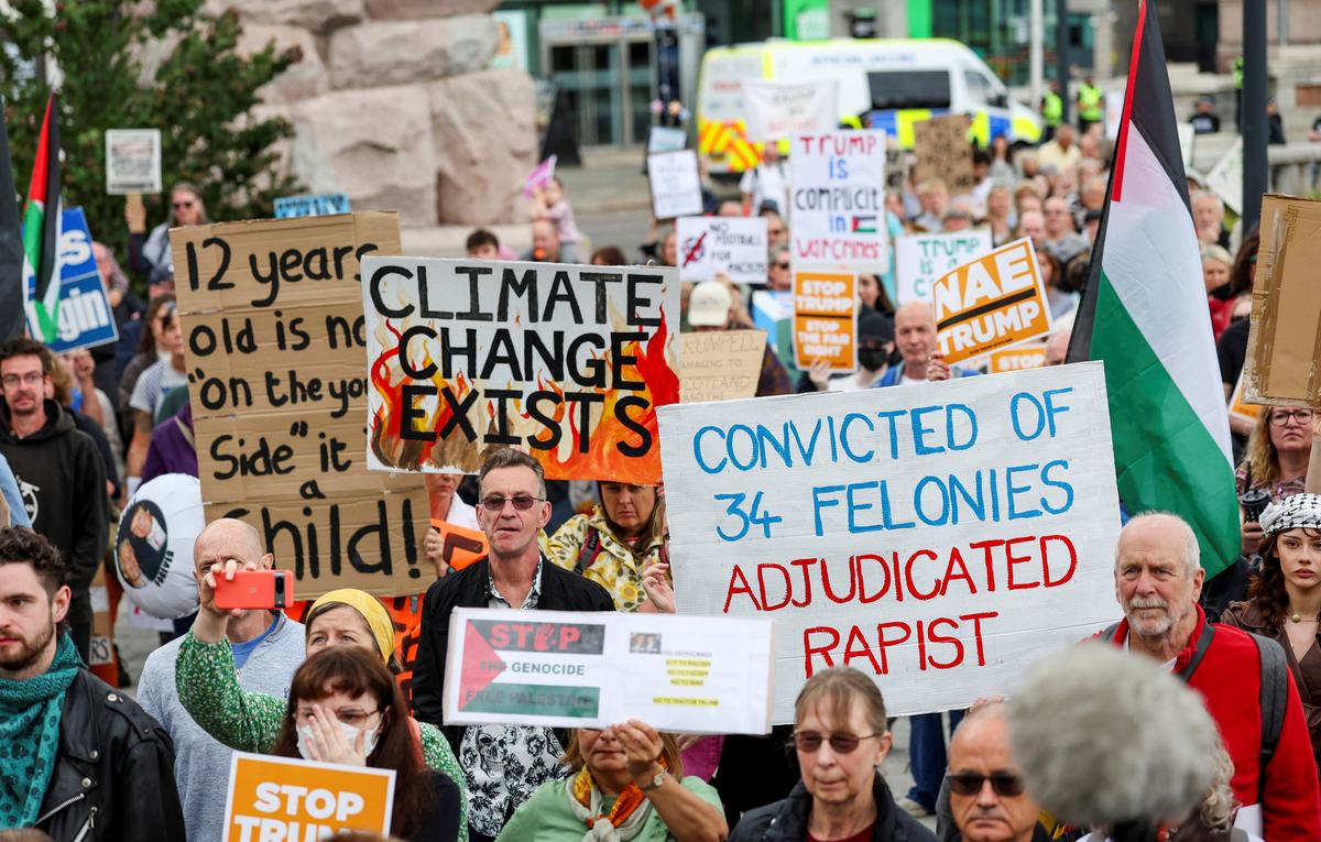 Anti-Trump demonstrators gather during a rally organised by the campaign group Stop Trump Coalition, protesting the visit of U.S President Donald Trump, in Aberdeen, Scotland, Britain, July 26, 2025. 