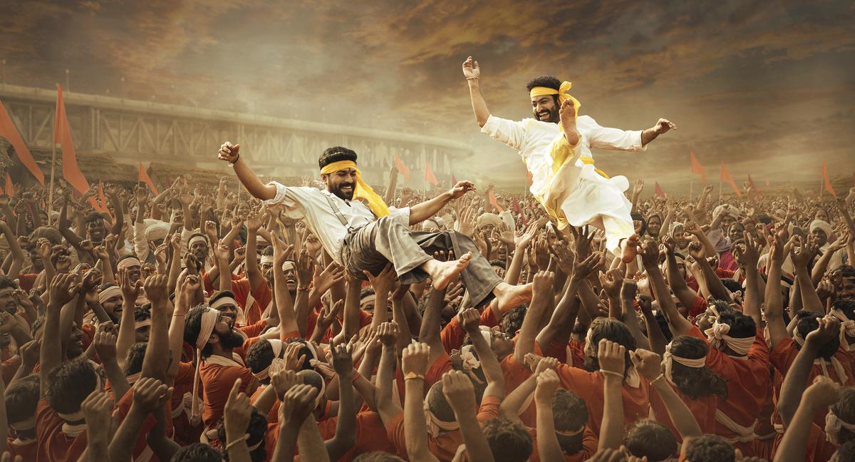 This image released by Netflix shows Ram Charan and N.T. Rama Rao Jr. in a scene from 'RRR.' (Netflix via AP)