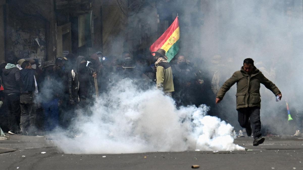 Police, protesters clash in new marches against Bolivian leader