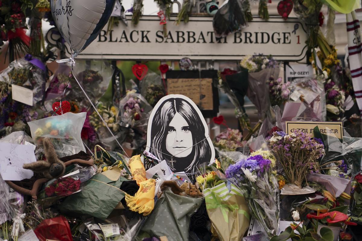 Floral tributes in front of the ‘Black Sabath bridge’ to honour musician Ozzy Osbourne as thousands of fans gathered to watch a funeral procession for Black Sabbath frontman Ozzy Osbourne following his death aged 76, in Birmingham, England, Wednesday, July 30, 2025. Floral tributes in front of the ‘Black Sabath bridge’ to honour musician Ozzy Osbourne as thousands of fans gathered to watch a funeral procession for Black Sabbath frontman Ozzy Osbourne following his death aged 76, in Birmingham, England, Wednesday, July 30, 2025.