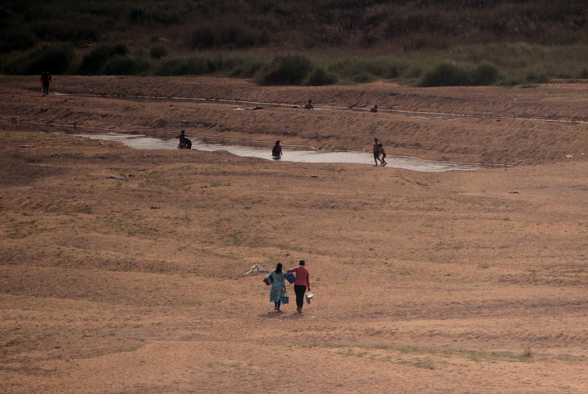 Villagers are seen as they are heading towards the remaining water of a river to collect waters for their families domestic uses just outskirts of Kantabanji town of Balanir district of western Odisha. Maximum stream line rivers are dried out in every summer season and people always facing water scarcity in these areas. 