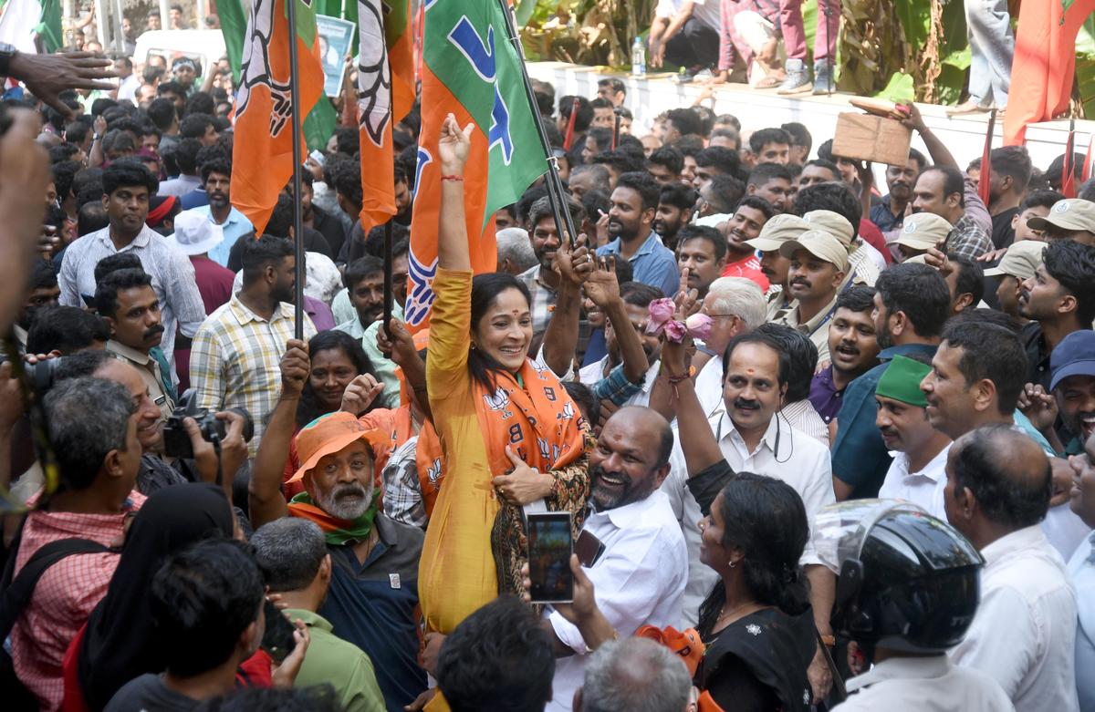 Sreeja C. Nair, NDA candidate in Mavoor Road ward of the Kozhikode Corporation, celebrating her victory with party workers in Kozhikode on Saturday.