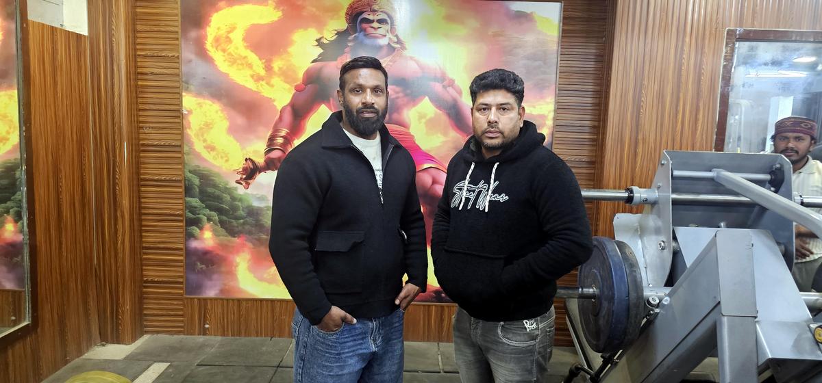 Deepak Kumar (left) with Vijay Rawat at his gym in Kotdwar. 