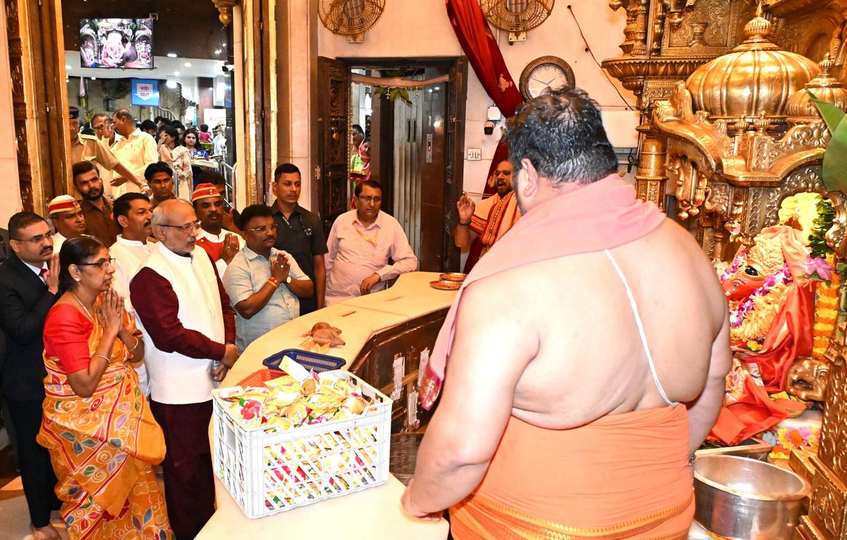 Maharashtra Governor C.P. Radhakrishnan accompanied by his wife Sumathi offering prayers at the Siddhivinayak Temple in Mumbai on Sunday (August 17, 2025). Maharashtra Governor C.P. Radhakrishnan accompanied by his wife Sumathi offering prayers at the Siddhivinayak Temple in Mumbai on Sunday (August 17, 2025).