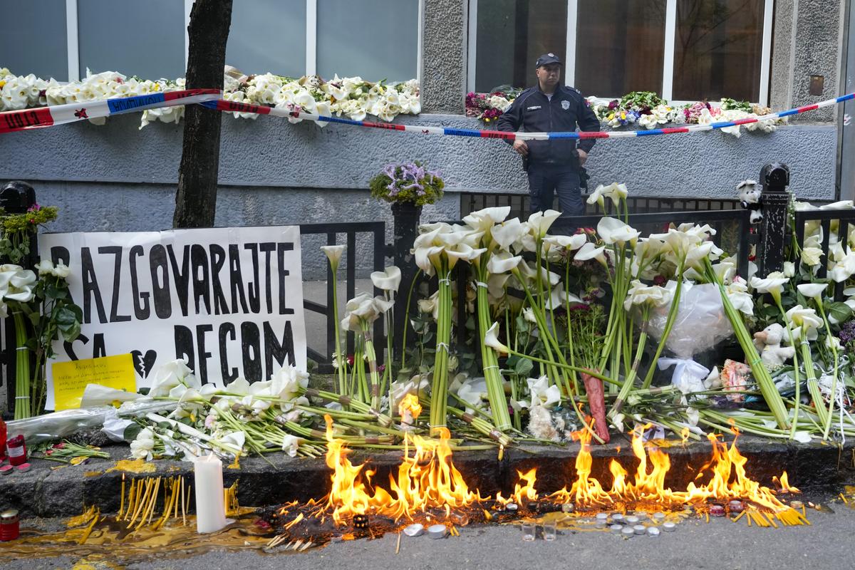 A police officer guards the Vladimir Ribnikar school, two days after a 13-year-old boy used his father’s guns to kill eight fellow students and a guard, in Belgrade, Serbia on May 5, 2023. 