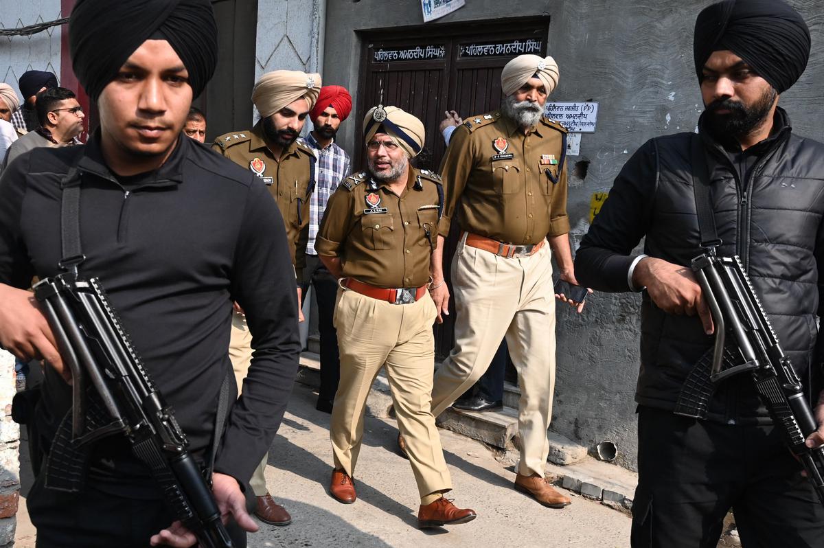 Punjab Police officers conduct a search operation in a drug hotspot in Amritsar on November 15, 2022. 