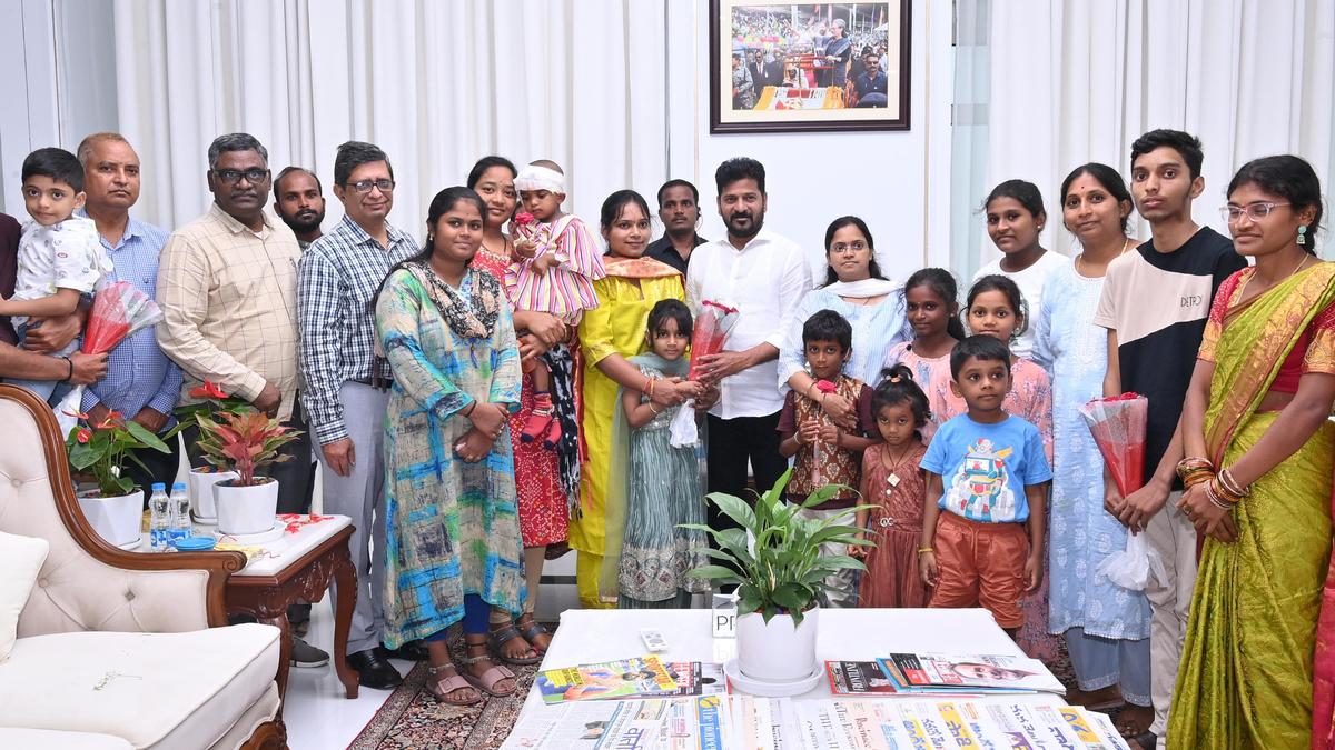 Children tie Rakhi on Revanth Reddy in gratitude for free medical treatment