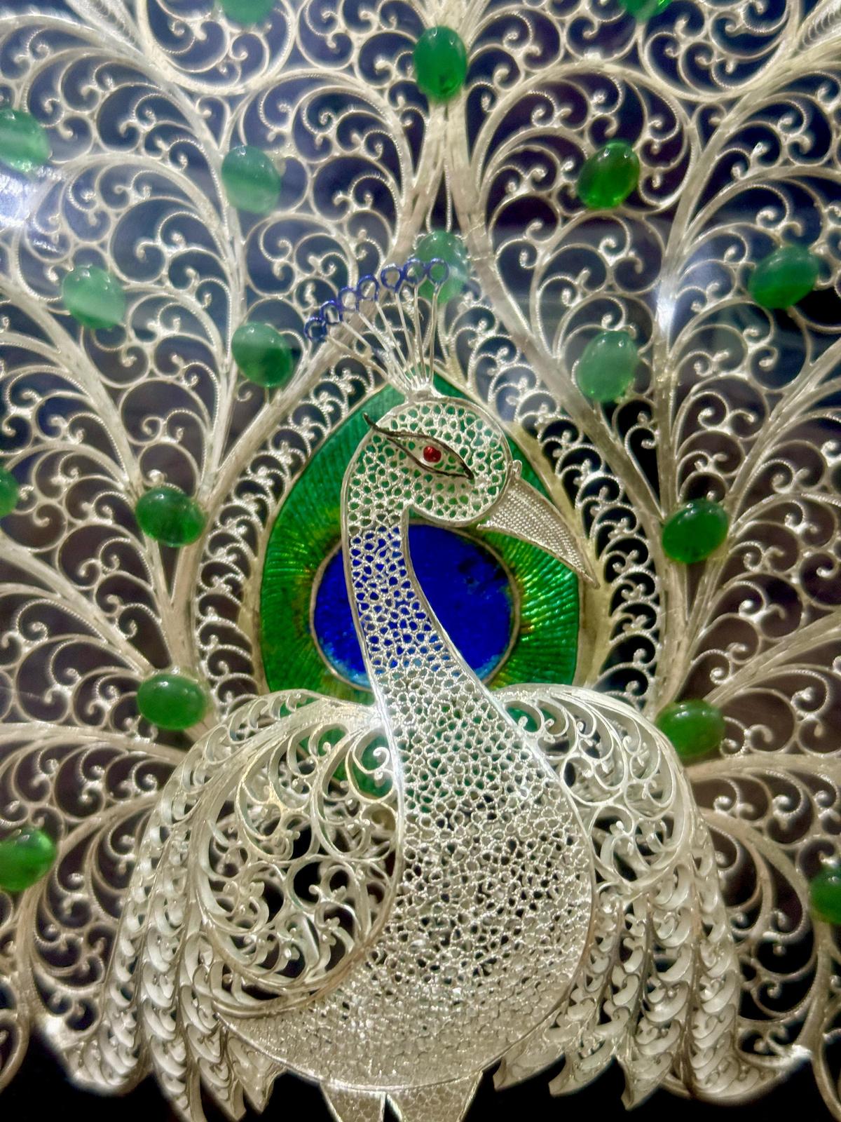 An exquisitely crafted peacock in silver filigree style by craftsmen from Karimnagar.