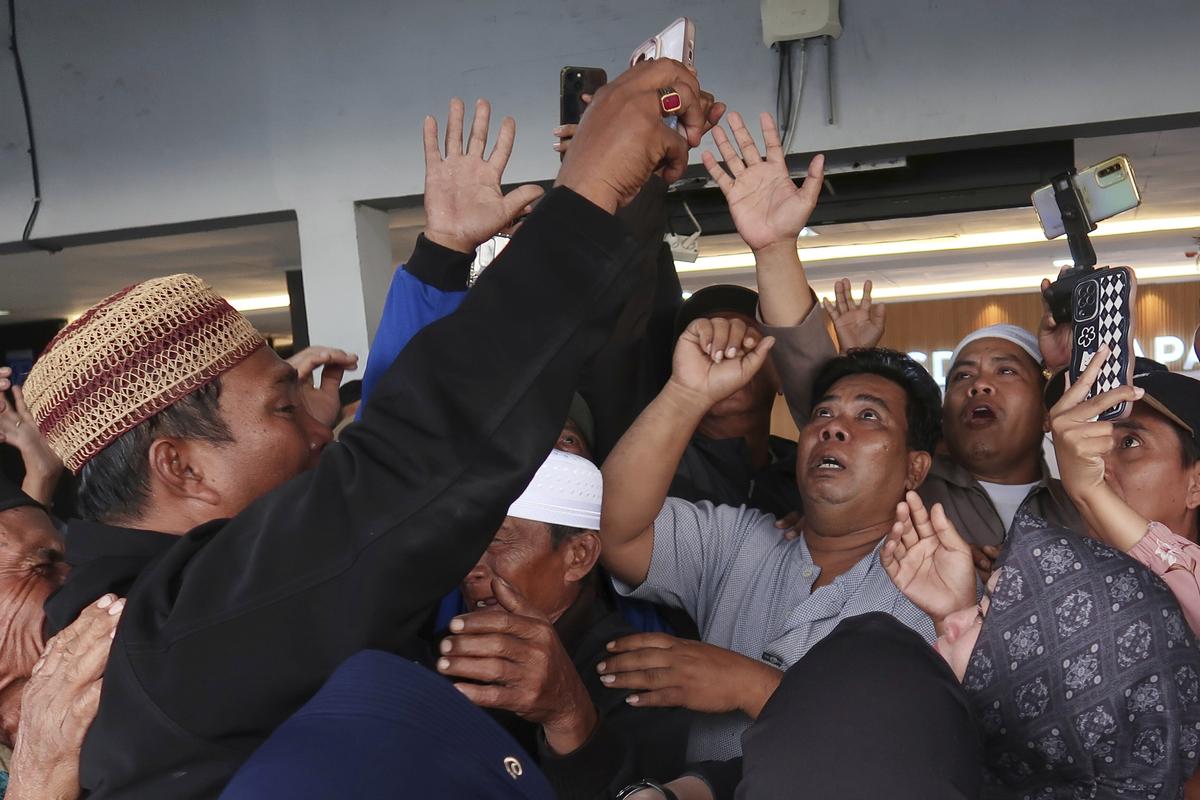 Relatives react as they have a video call with a survivor from a ferry that sank near the resort island of Bali, at Ketapang Port in Bayuwangi, East Java, Indonesia on July 3, 2025. Relatives react as they have a video call with a survivor from a ferry that sank near the resort island of Bali, at Ketapang Port in Bayuwangi, East Java, Indonesia on July 3, 2025.