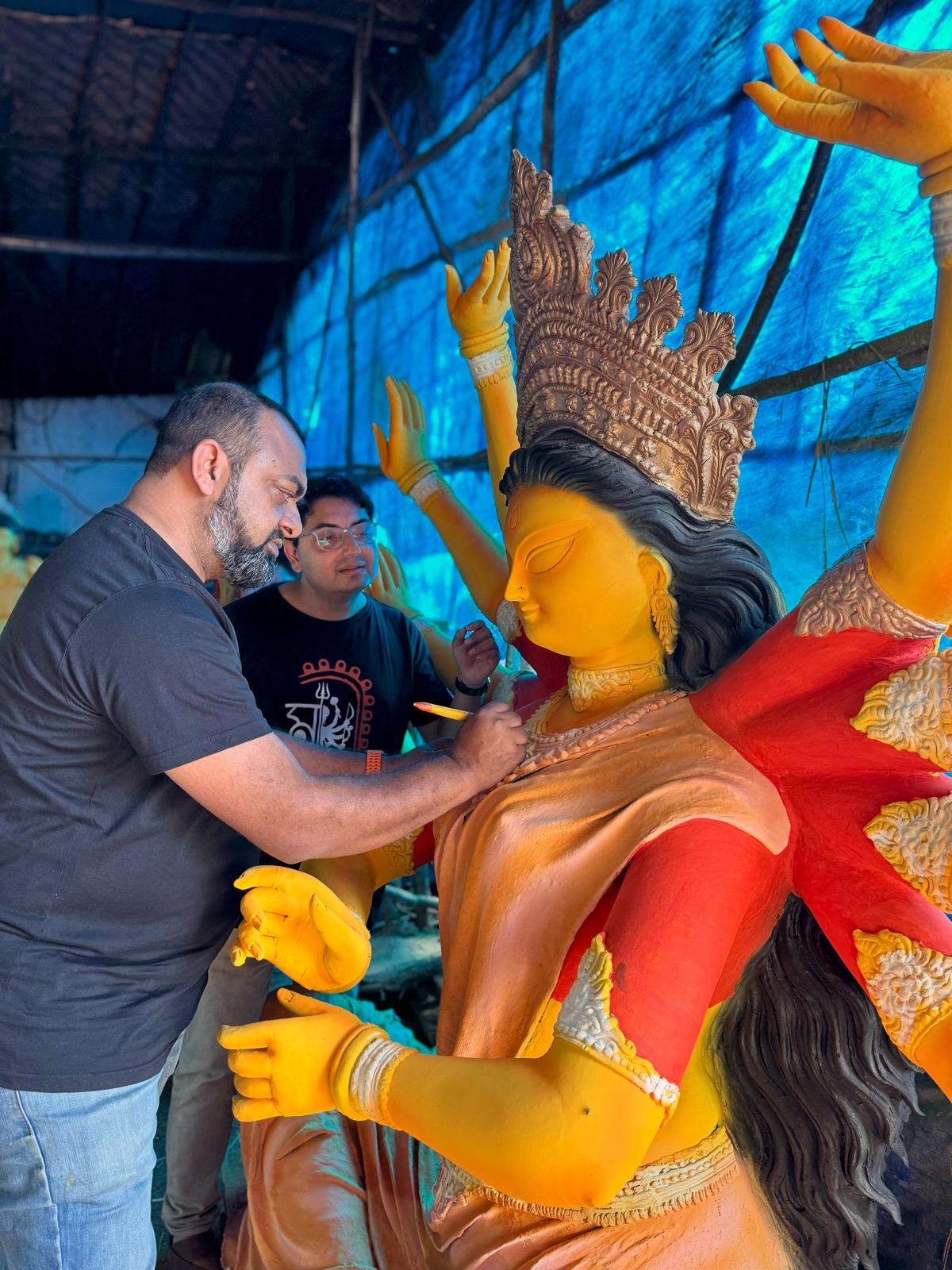 Tirthankar Chattopadhyay (creative design) and Shwetanuj Saha of The Cyberabad Bangali Association