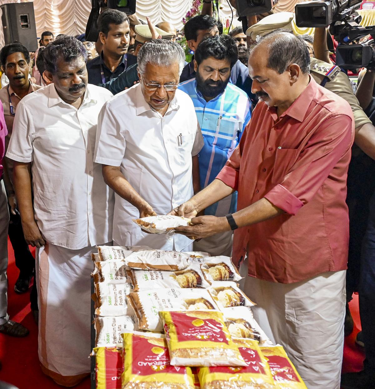 Kerala Chief Minister Pinarayi Vijayan with state ministers Antony Raju and G.R. Anil during the inauguration of a State-level Christmas fair, in Thiruvananthapuram on Saturday.