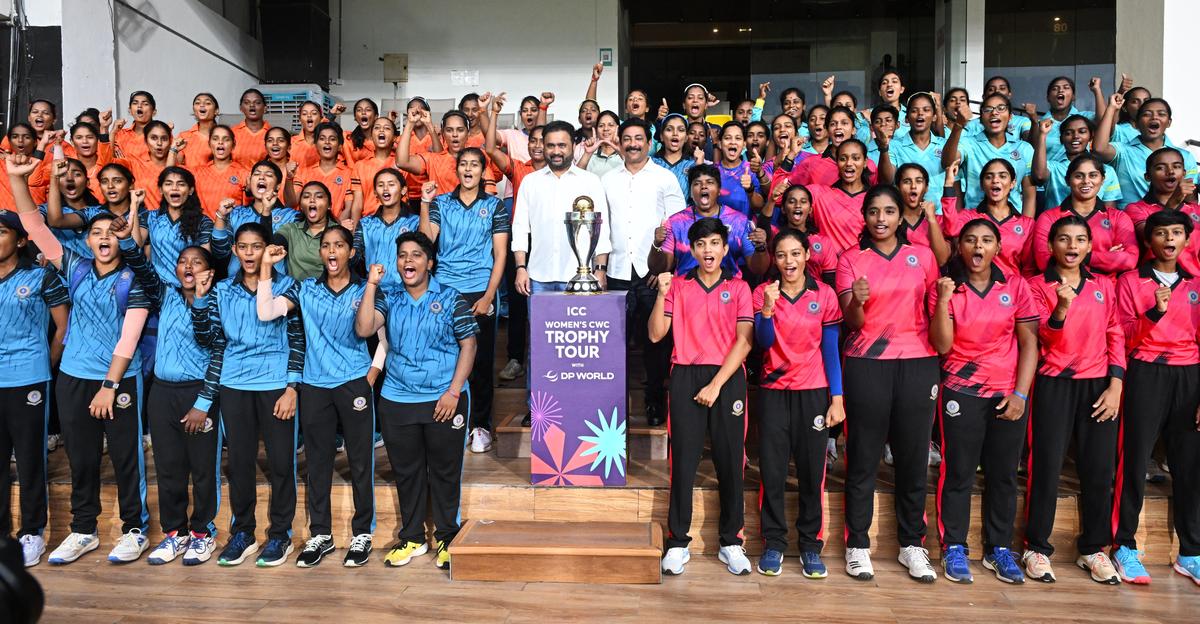 Members of Andhra Cricket Association and women cricketers pose with the ICC Women’s Cricket World Cup trophy during its tour at the ACA-VDCA Cricket Stadium in Visakhapatnam on Sunday.