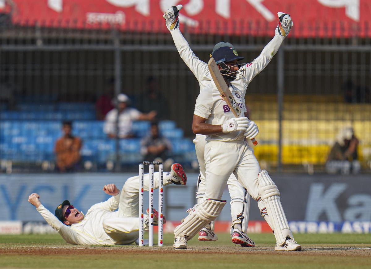 Sheer brilliance: Steve Smith  pulls off a fantastic catch to dismiss Cheteshwar Pujara on Thursday.
