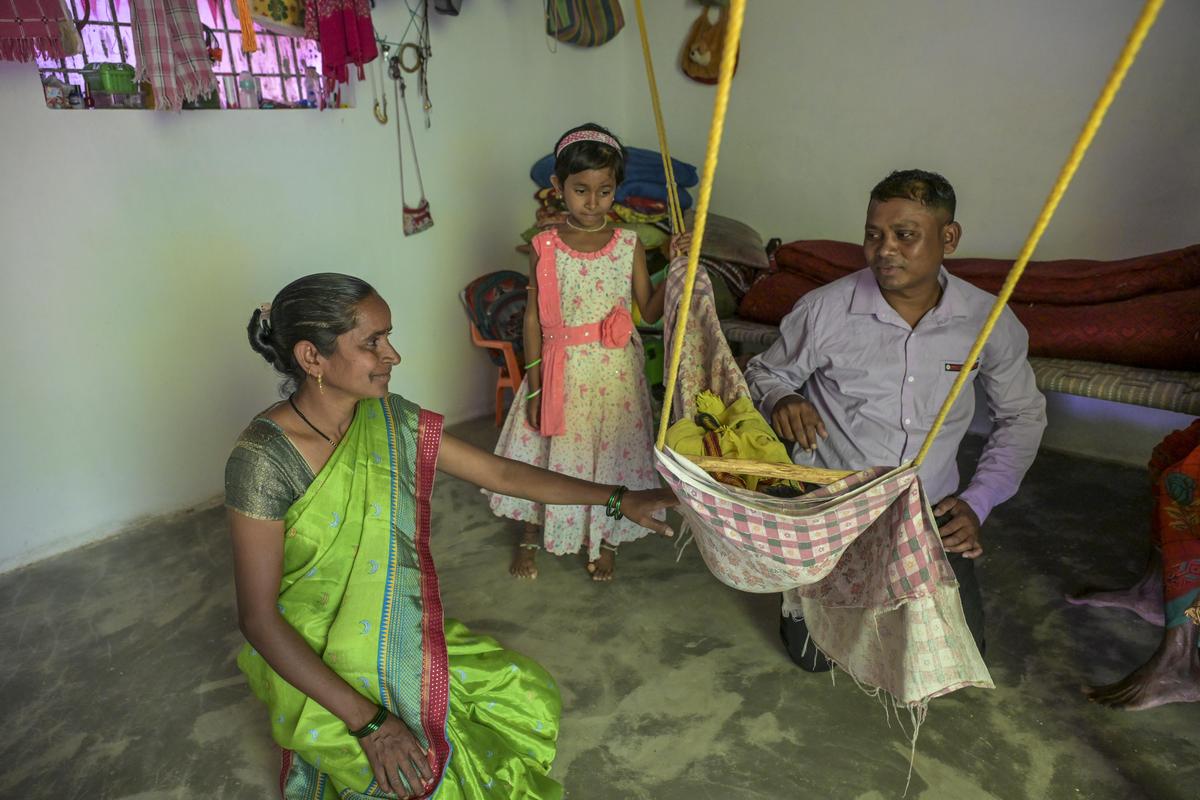 Ashok and Sushila Hodi with their daughters at home in Navjeevan Vasahat.