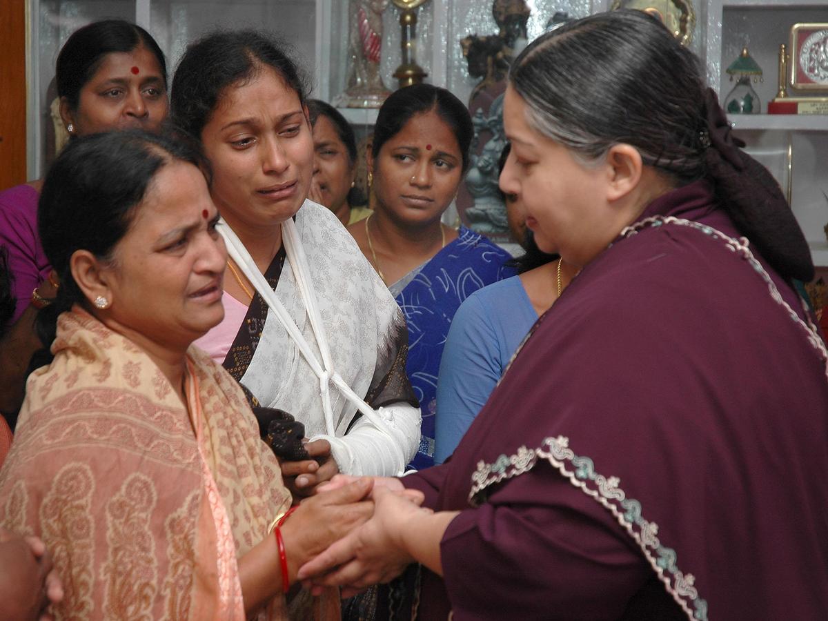 Chief Minister Jayalalithaa consoling Jayammal, wife of Gummidipondi MLA K. Sudharsanam, at Thanakulam in Tiruvallur district on January 10, 2005. 