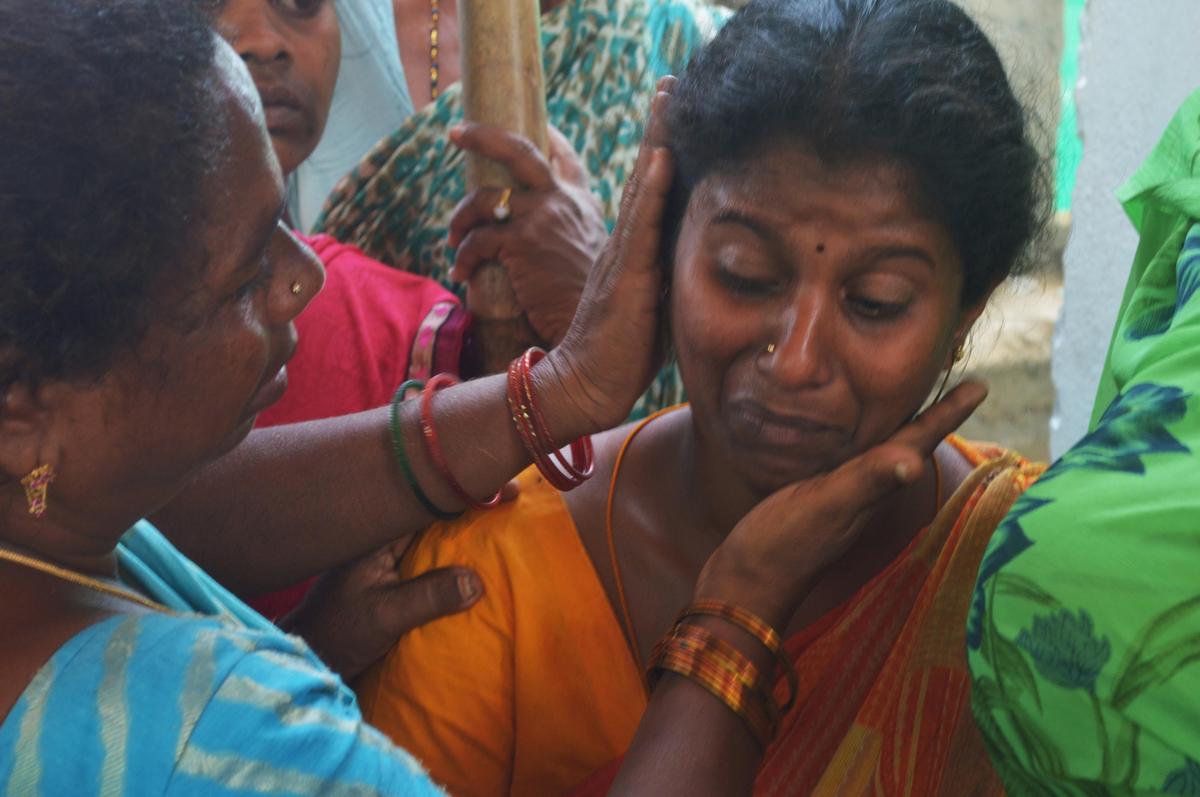 Chandra Kala, who lost her mother in the tragedy, being consoled by locals in Vetlapalem village.