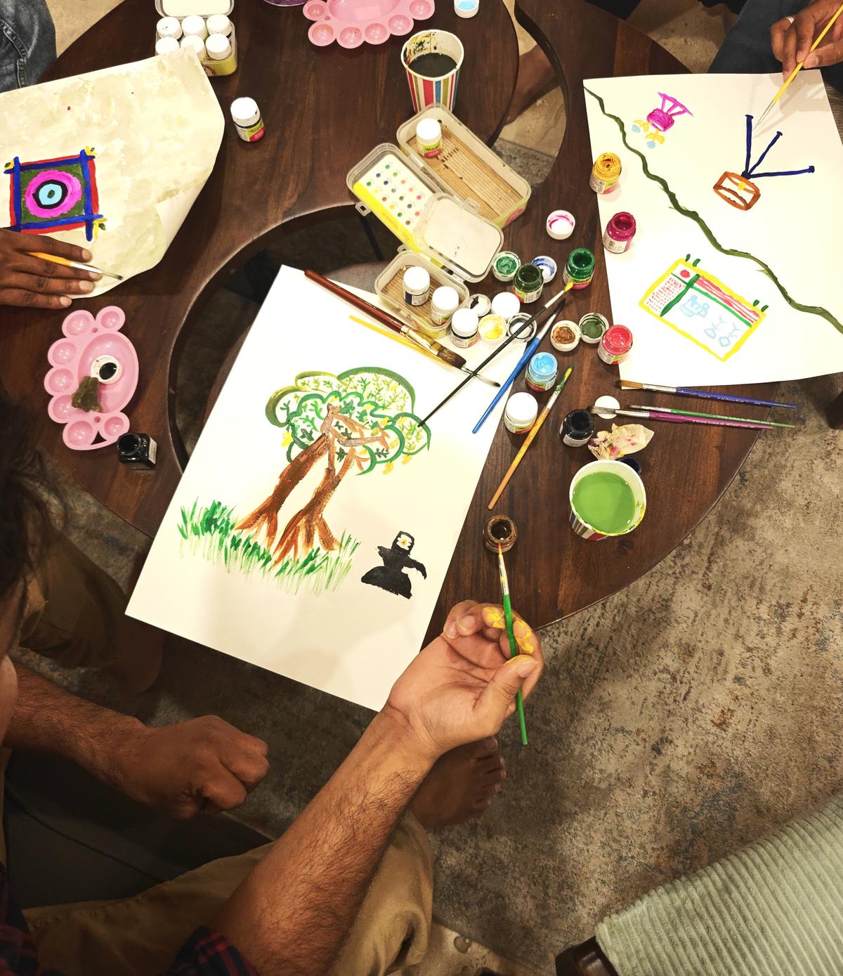   Participants explore different artforms at an expressive arts therapy session being  conducted by therapist Pallavi Banothu at Align Hub in Hyderabad