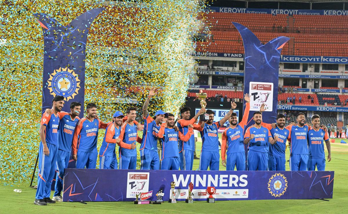 Indian team celebrating with the cup after winning the third T20I against Bangladesh at Rajiv Gandhi International Cricket Stadium.