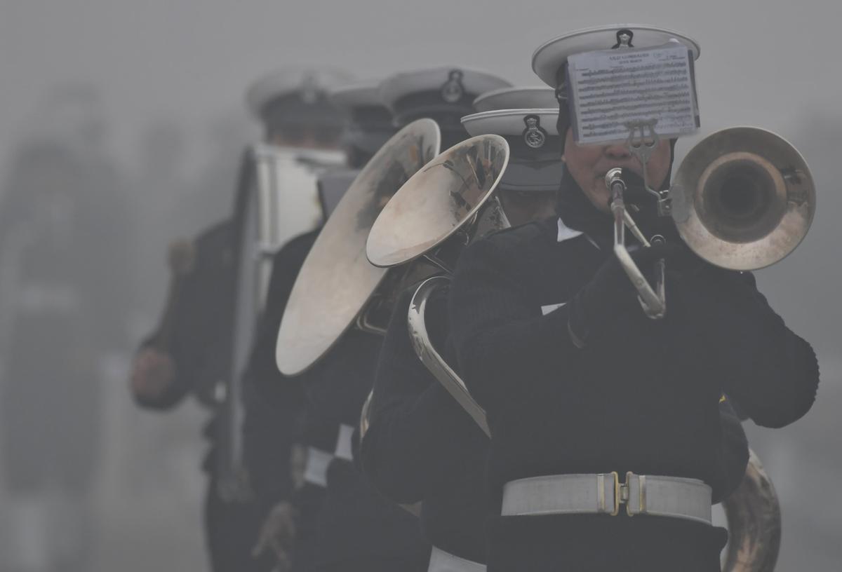 Armed forces personnel rehearse for the Republic Day parade 2024 during fog on a cold winter morning at Kartavya path in New Delhi on January 14, 2024. 