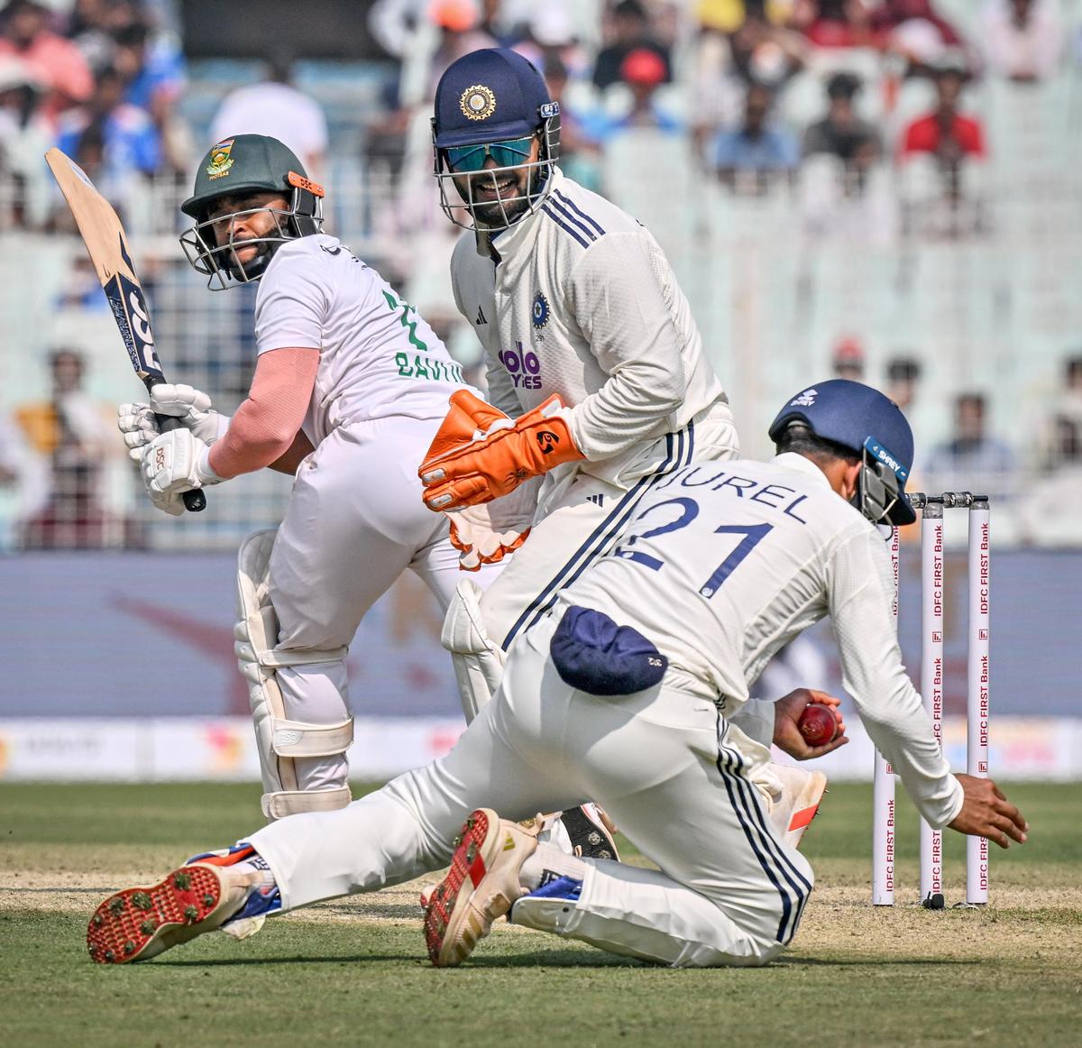 Dhruv Jurel takes the catch to dismiss South Africa's captain Temba Bavuma, on the first day of the first cricket Test match