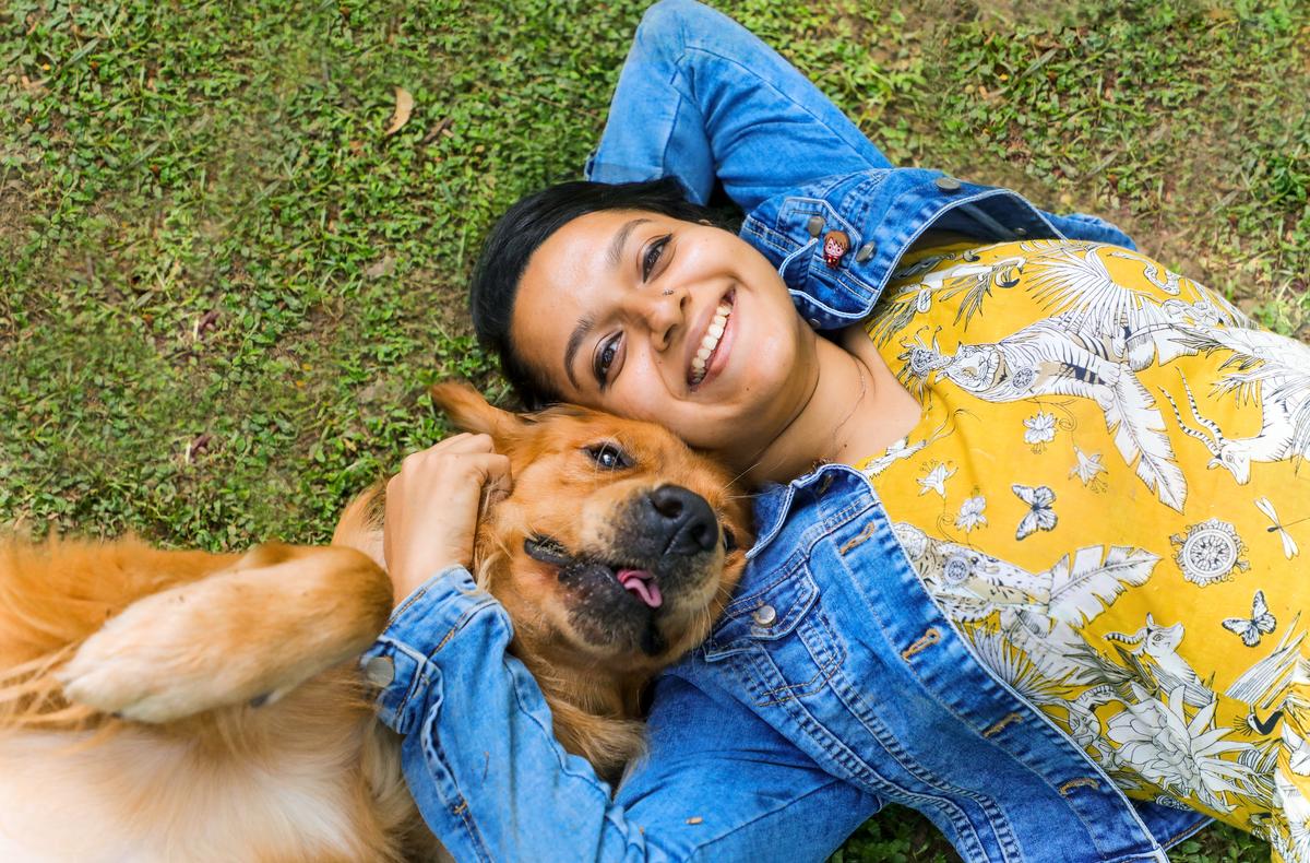 Golden Retreiever Loki with Sanghamitra; a photograph by Saloni Khatri