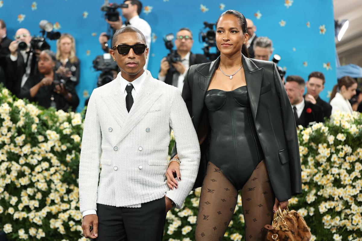 Pharrell Williams and Helen Lasichanh pose during the Met Gala, an annual fundraising gala held for the benefit of the Metropolitan Museum of Art’s Costume Institute with this year’s theme ‘Superfine: Tailoring Black Style,’ in New York City, New York, U.S., May 5, 2025.