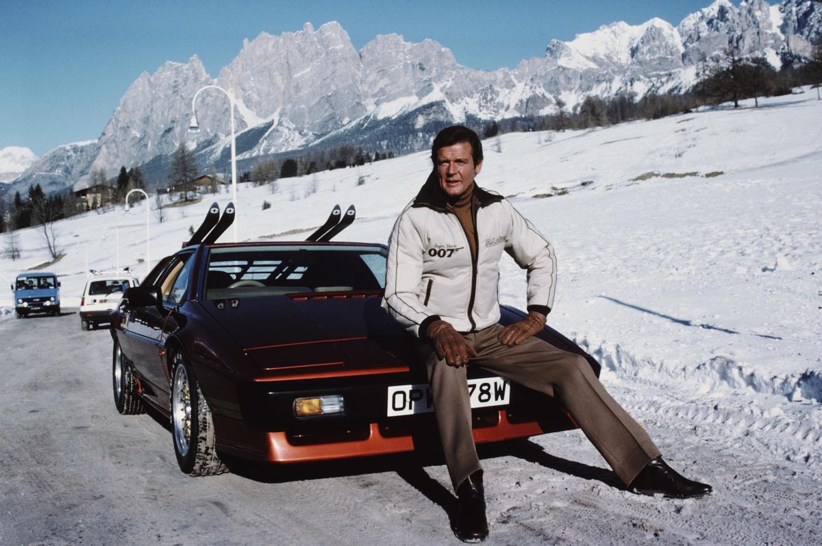 Actor Roger Moore poses as 007, with a Lotus Esprit Turbo, on the set of For Your Eyes Only, 1981. 