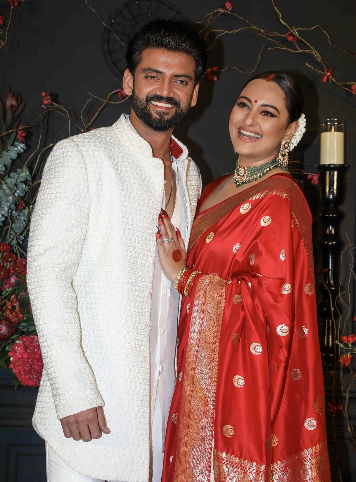 Mumbai: Actor couple Sonakshi Sinha and Zaheer Iqbal poses for photos at their wedding ceremony, in Mumbai, Sunday, June 23, 2024